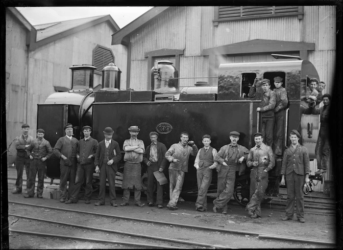 H class steam locomotive, NZR 199, 0-4-2T type, for use on the Fell system on the Rimutaka Incline, with a group of men standing on and beside the engine.