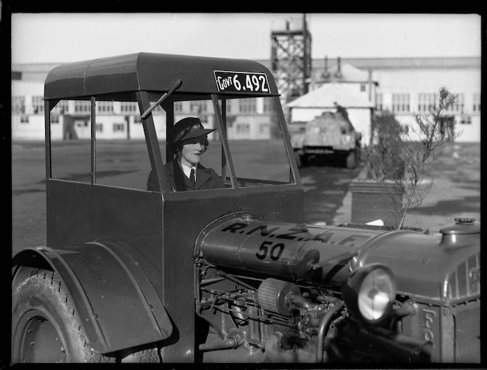 Member of the Women's Auxiliary Air Force driving a tractor