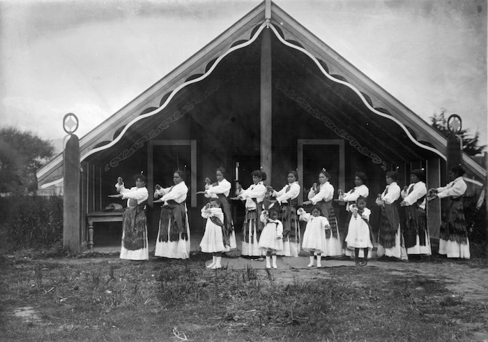 Women and girls performing a poi dance