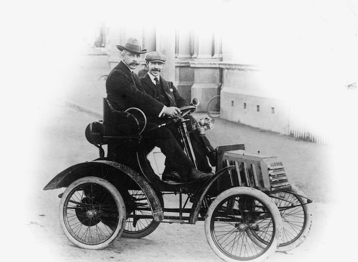 Men in an early motor car