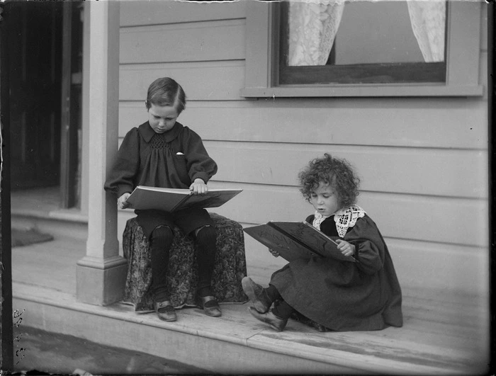 Edgar (on left) and Owen Williams looking at books on the verandah of the Royal Terrace home, Kew, Dunedin