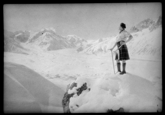 Unidentified man in a Scottish kilt, with an ice pick, on a snow covered mountain, Ball Hut, Mount Cook National Park, Canterbury Region