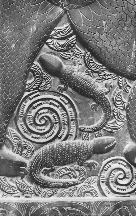 Maori wooden carving featuring spirals and lizard type shapes
