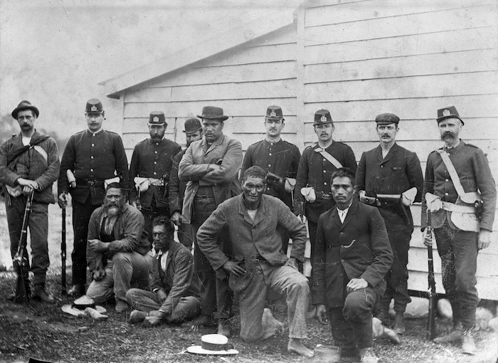 Policemen with a group of Maori who participated in the Dog Tax Rebellion