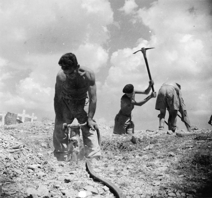 World War 2 New Zealand Engineers digging graves south of Florence, Italy - Photograph taken by K G Killoh