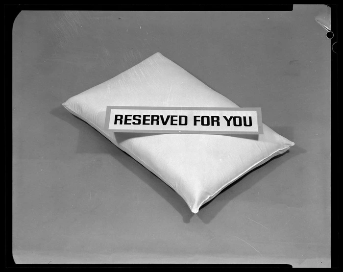 Pillow with 'Reserved for you' sign on top