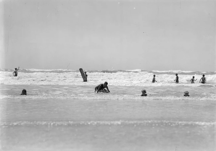 Surfers and swimmers, New Brighton beach, Christchurch