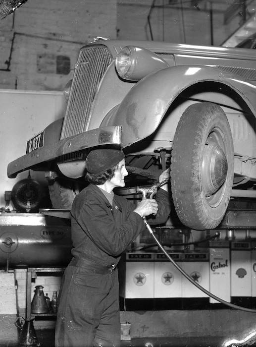 Unidentified member of the New Zealand women's services working on a car during World War 2