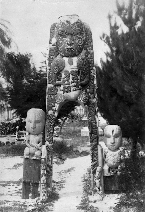 Maori wooden carved gateway and wooden figure carvings at Ohinemutu