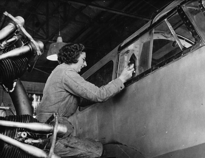 Weigel, William George (Photographer) : Unidentified member of the Women's Auxiliary Air Force repairing a plane at Wigram aerodrome