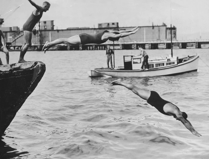 Swimmers diving into Wellington Harbour at the start of the long distance handicap Peck Shield Harbour Race - Photographer unidentified