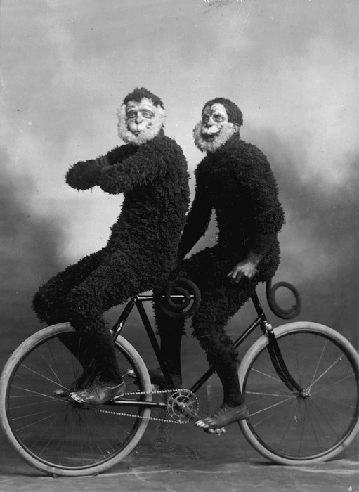 Members of the Invercargill Cycling Club riding a bicycle in monkey costume
