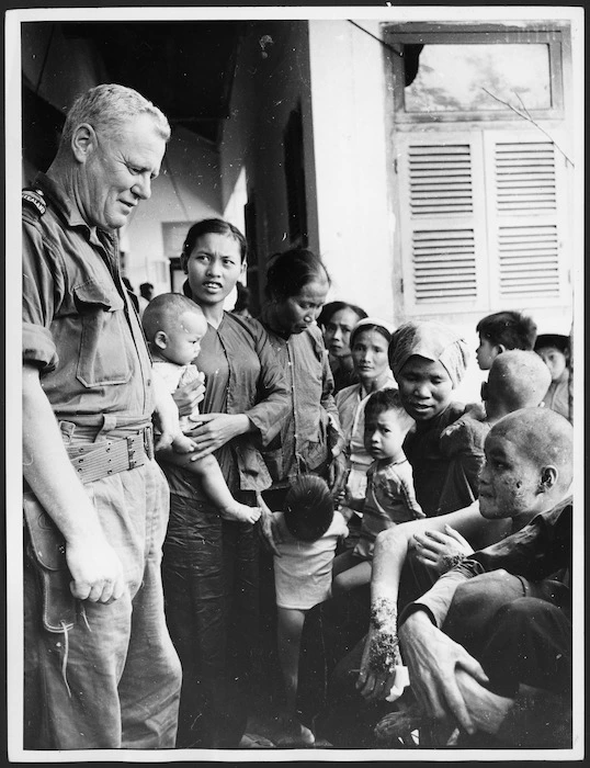 Vietnamese women and children awaiting treatment at the Bong Son district dispensary during the Vietnam War - Photographer unidentified