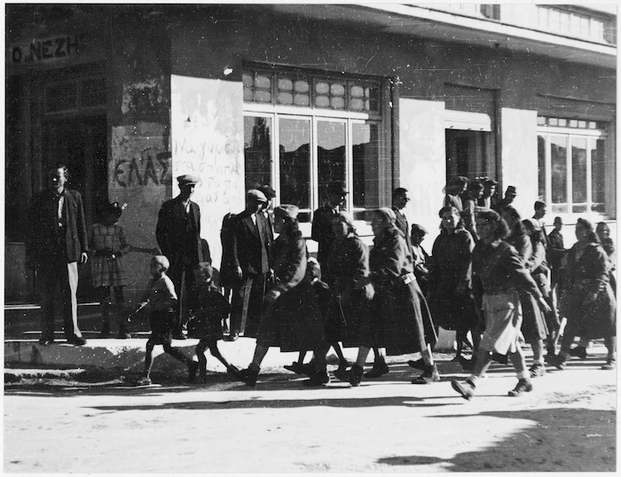 Greek female partisans marching from Parnassus through a village near Athens