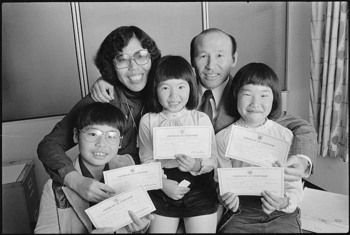 Jung Lee and his family holding their nationalisation certificates - Photograph taken by Ron Fox