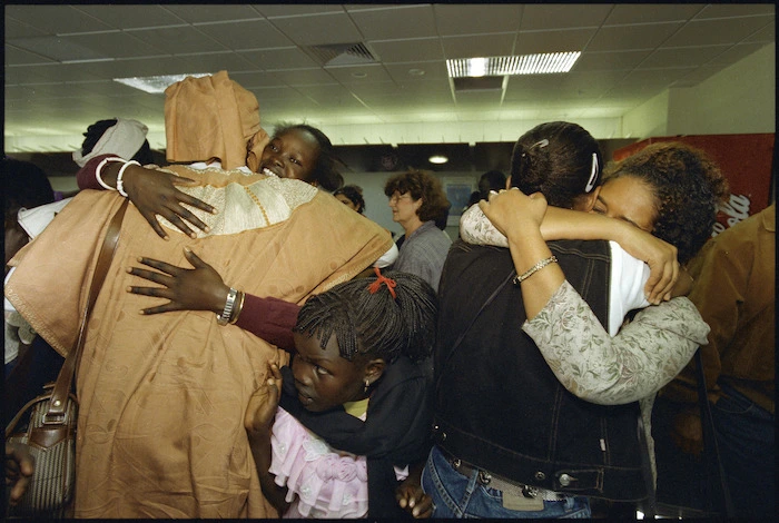 Ethiopian refugees Senayint Ayla and Meskerm Solomon embrace after reuniting at Wellington Airport - Photograph taken by Ross Giblin