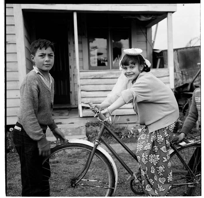 Children playing with bicycle, possibly at Huntly