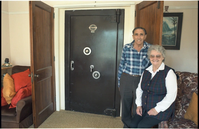 Joe and Pauline North alongside the old Reserve Bank vault inside their house at Rata Street, Naenae, Lower Hutt - Photograph taken by Melanie Burford