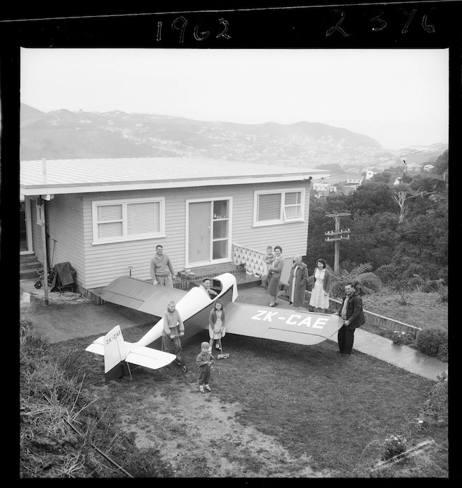 Mr R G Gentry in his home built aircraft, outside his house in Mornington, Wellington