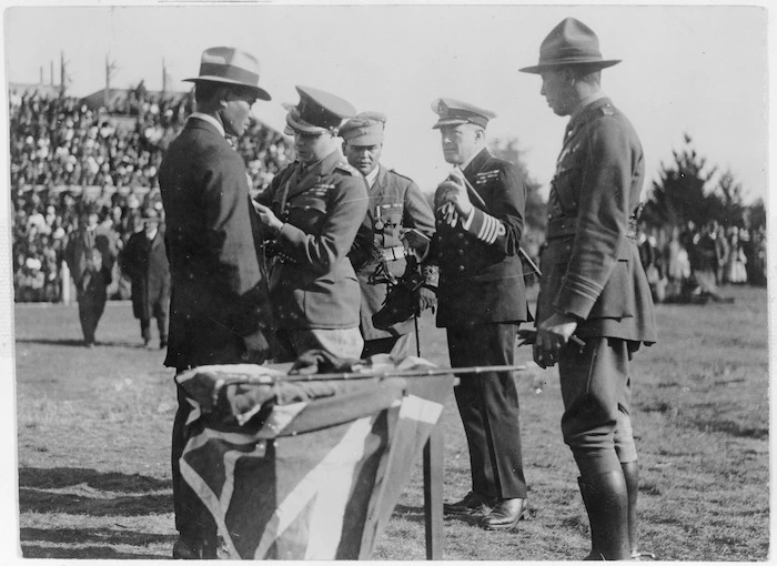 Edward, Prince of Wales, presenting a decoration to a member of the Pioneer Battalion at Rotorua