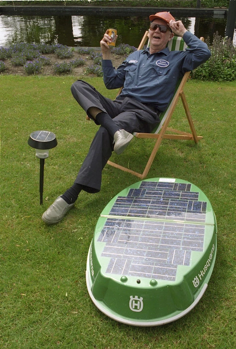 George Ryan and a solar-powered lawnmower - Photograph taken by Ray Pigney