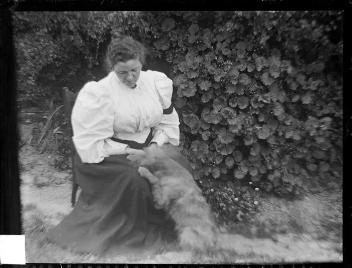 Amy Kirk and dog in garden