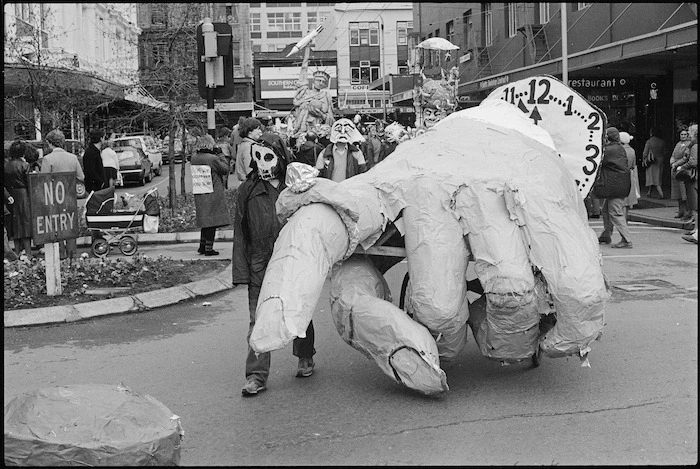 Demonstrators with a large papier-mache hand at an antinuclear demonstration, Wellington - Photograph taken by Stuart Ramson