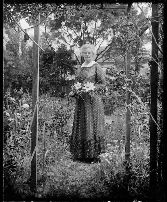 Cybele Ethel Kirk posing with lilies