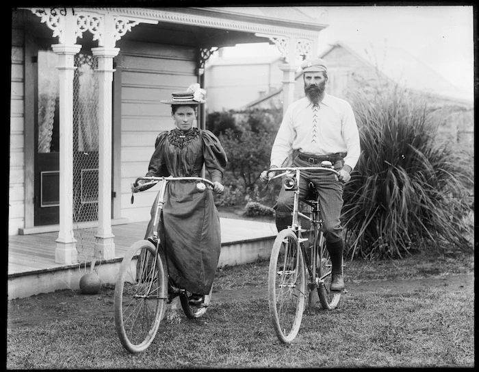 Two members of the Curtis family on bicycles