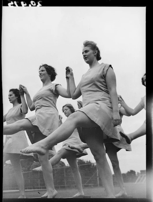 Female trainee physical education instructors performing leg swings, Hutt Valley, Wellington