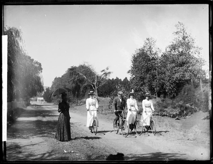 Griffiths family, including four on bicycles, probably Wanganui district