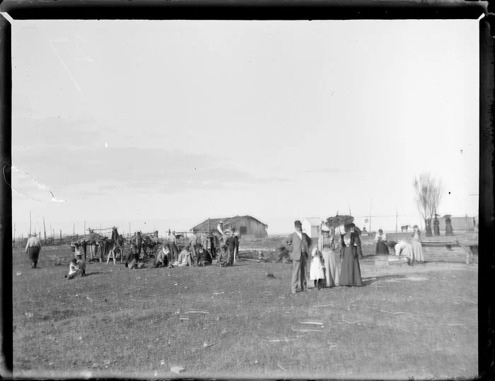 Scene during the Maori parliament (Kotahitanga) at Pakirikiri Pa, Gisborne Region, featuring cooking as well as Maori and European groups