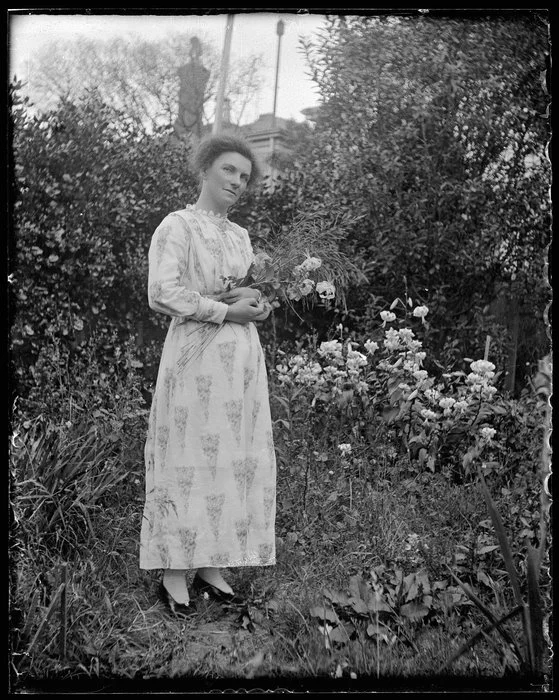 Woman holding sheaf of flowers