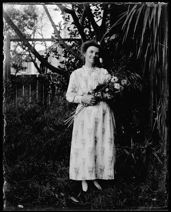 Woman holding sheaf of flowers