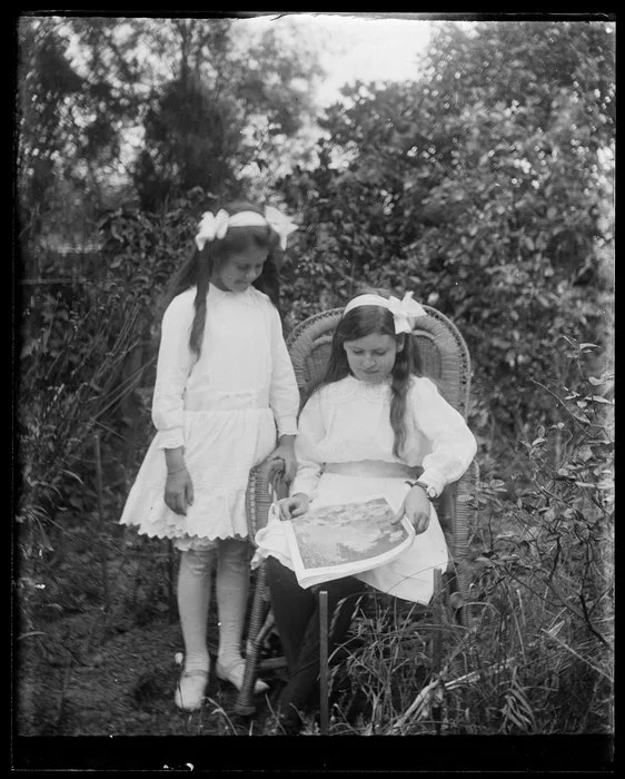 Two young girls in a garden