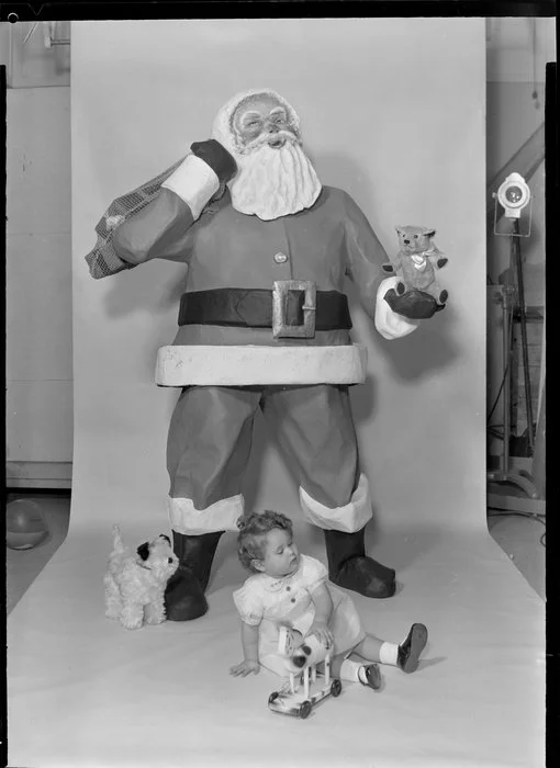 Father Christmas model with small girl