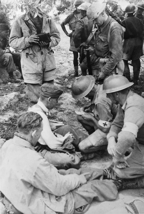New Zealand ambulance men attending to German paratroopers