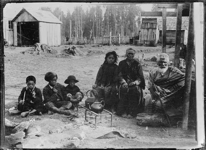 Maori family group cooking outdoors