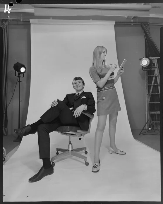J.I.W., man & woman posing in studio