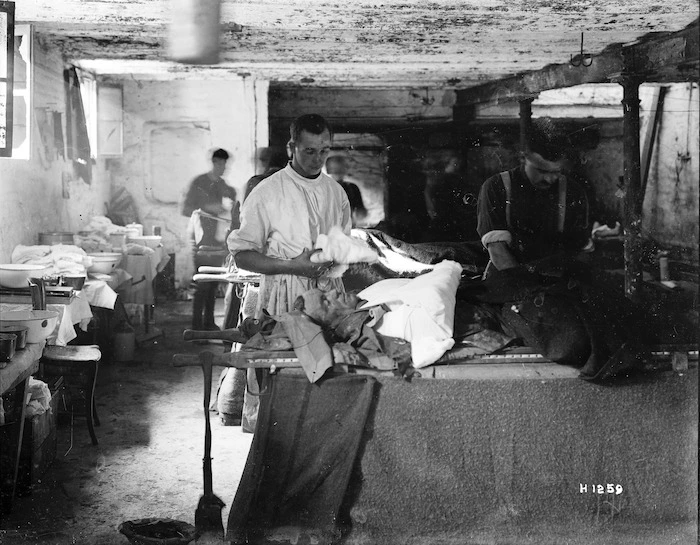 Wounded World War I soldier being cared for at a field hospital