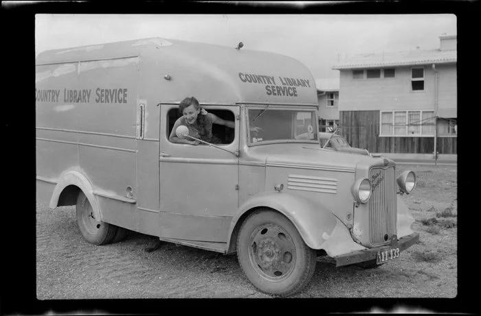 Unidentified woman with the Country Library Service van, Kawerau