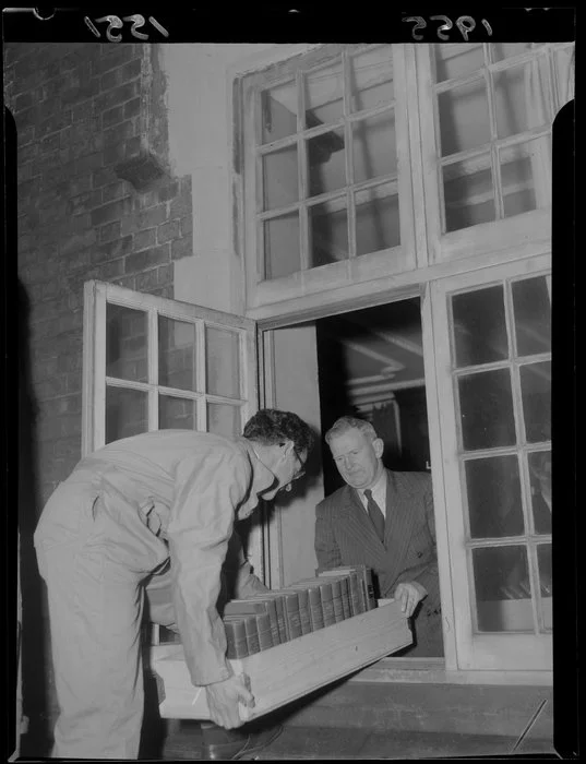 Staff of the Alexander Turnbull Library moving the book collection out of the Bowen Street building for the restrengthening in 1955-1957