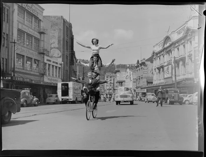 Four people on one bicycle in Courtenay Place, Wellington