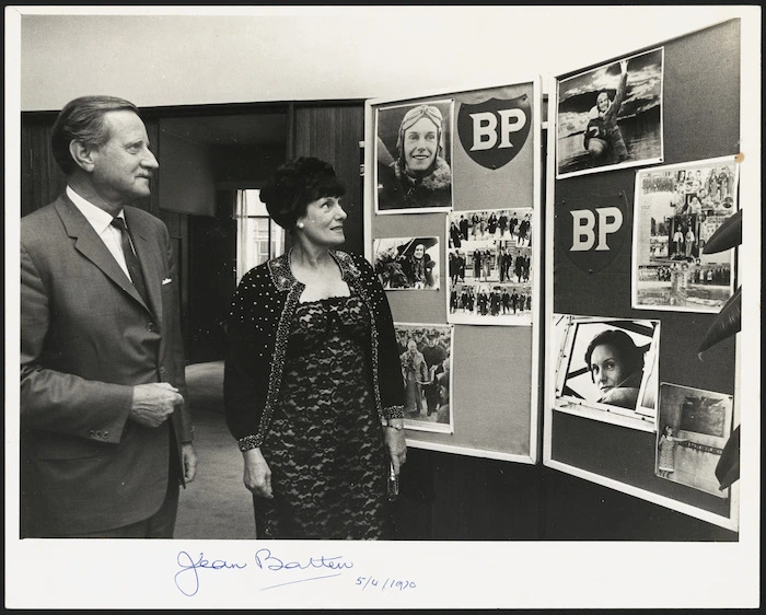 Aviator Jean Batten alongside a display of photographs - Photograph taken by Photo News
