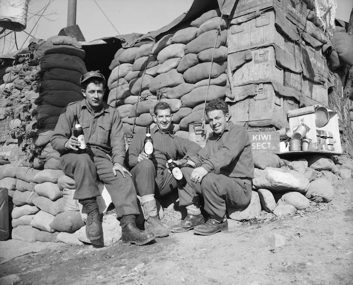 [New Zealand sappers having a beer outside their hut, Korea]