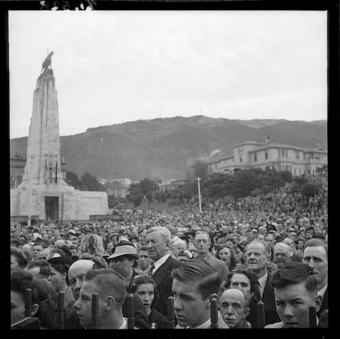 Crowd singing the national anthem at the official VE Day celebrations, Lambton Quay, Wellington