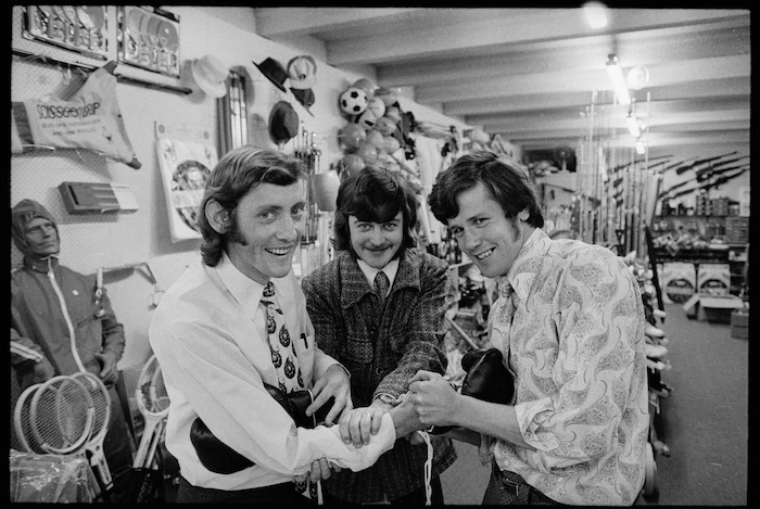 G Thorley, B Sturgess, and R Redden in a sports shop, Porirua, New Zealand