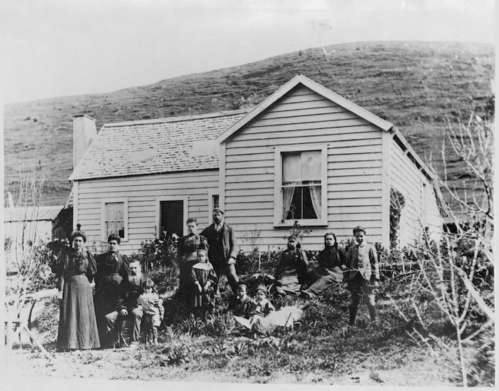 Portrait of the Thoms family and Edith Clarke outside the Thoms house at Te Awaiti, Marlborough Sounds