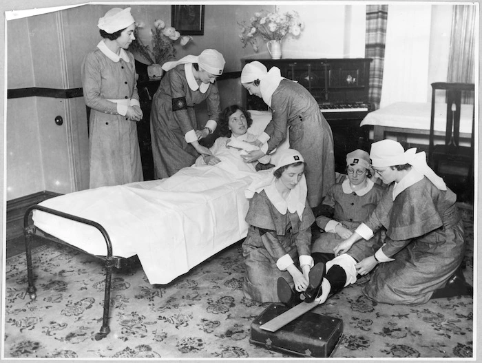 Members of the Order of St John demonstrating first aid