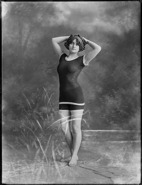 A woman identified as Lola, posing in a bathing costume, probably in Auckland